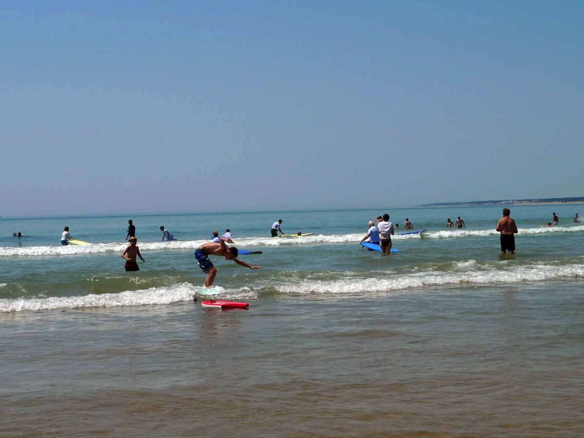 Fun in the Waves at La Terriere Plage