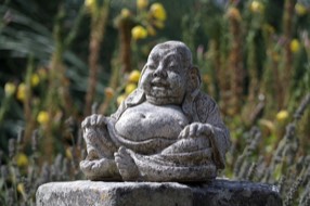 Bhudda in the garden at Maison Lairoux holiday homes