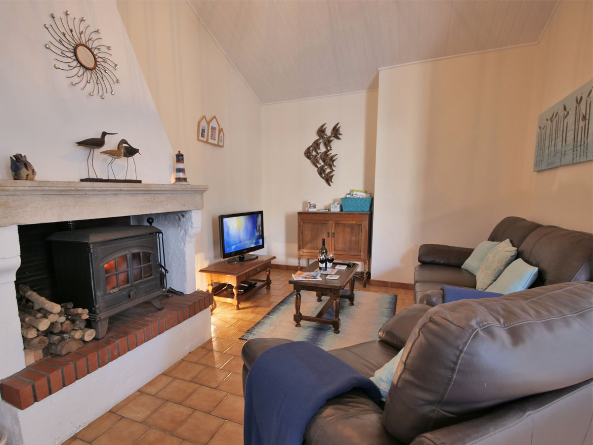 Cosy lounge at L Ecurie Holiday Cottage