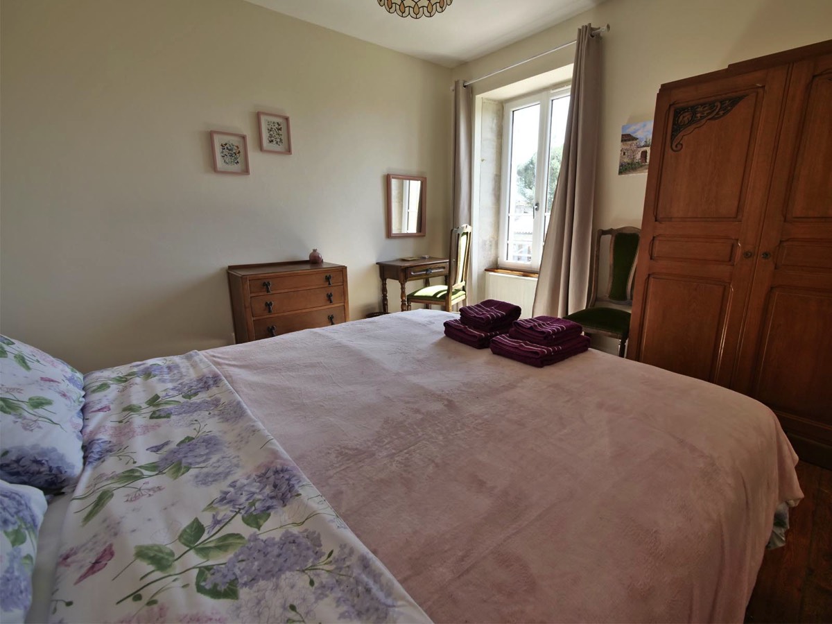 Relax in the large double bed in Le Vieux Cafe