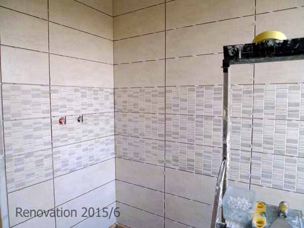 New tiles go in to both bathrooms